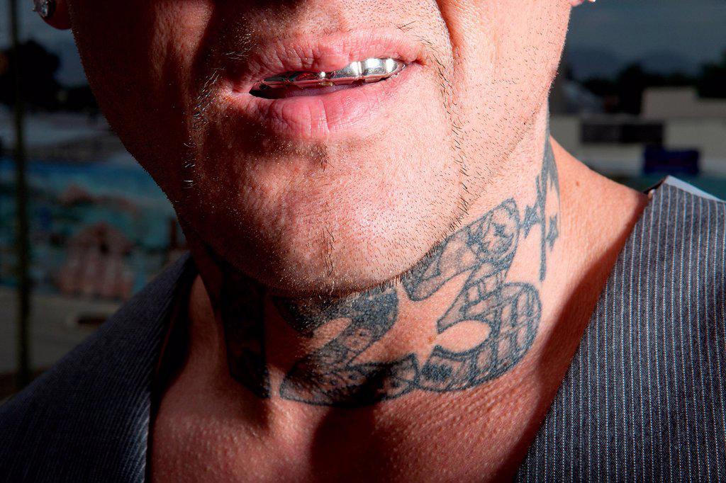 Man with tattooed neck
