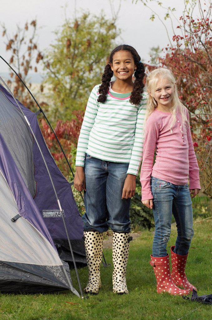 Two girls with tent