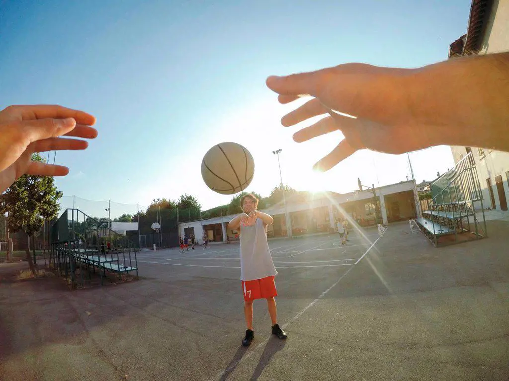 Point of view image of man throwing basketball at teammate