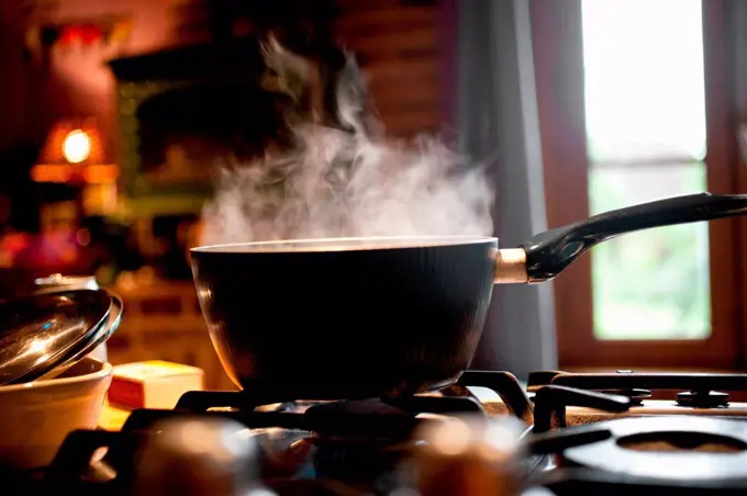 Steaming saucepan on gas hob