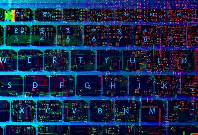 Double exposure of the inside and out of a laptop computer showing the electronic components under the keyboard
