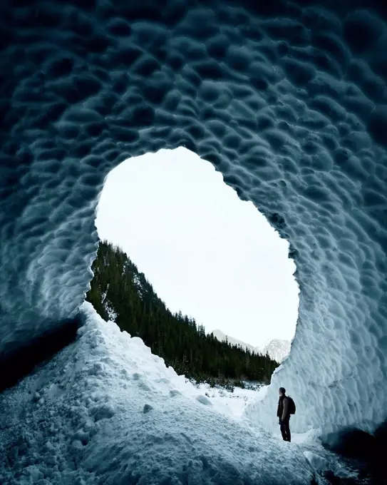 Man exploring Big Four Ice Caves, Snohomish, Washington, United States