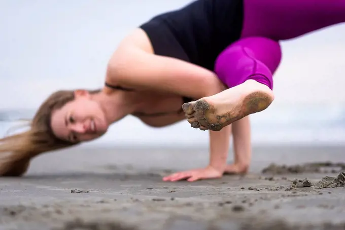 A Woman Doing Outdoor Yoga At The Beach In Rhode Island