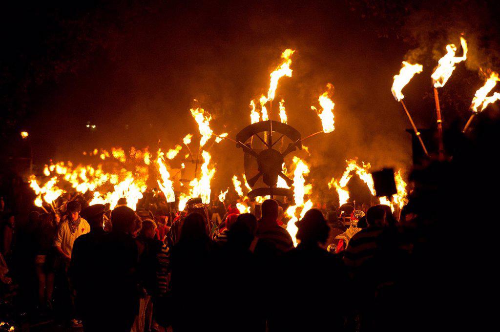 People marching along road for the East Hoathly Bonfire night; East Sussex, England