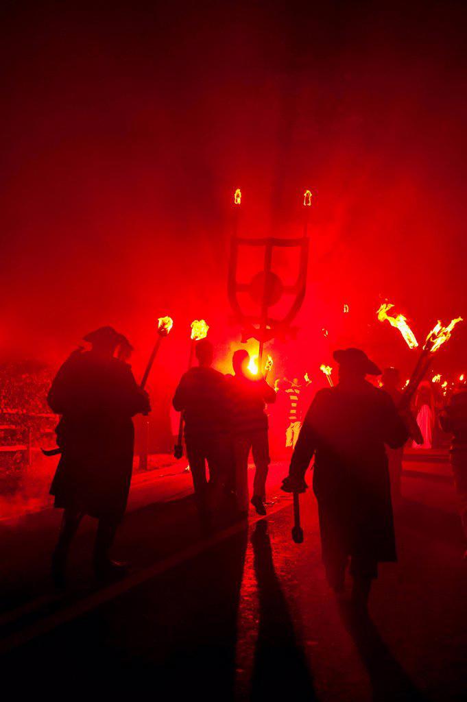 People dressed as pirates and smugglers from Southover Bonfire Society walking in procession of Nevill Junior Bonfire Night; Lewes, East Sussex, Engla...