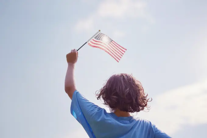 Boy waving American Flag