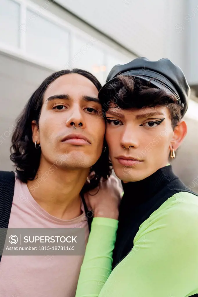 Gay man leaning on friend's shoulder