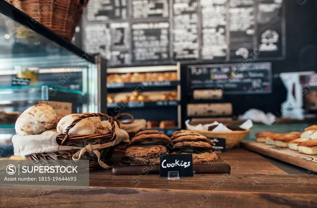 Fresh assortment of cookies and breads on table in bakery