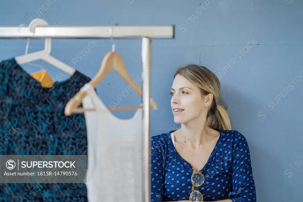 Portrait of smiling fashion designer in her studio