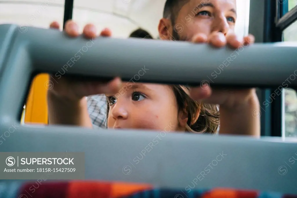 Czechia, Prague, little girl and her father going by bus