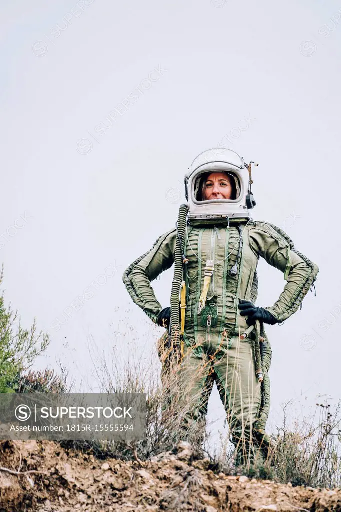 Woman in space suit exploring nature