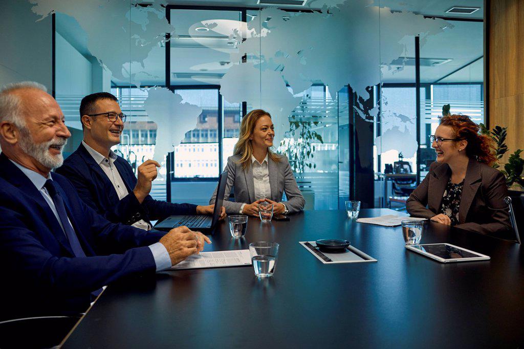 Group of happy business people having a meeting