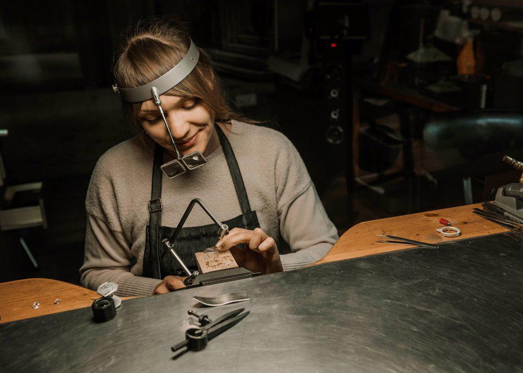 Artisan making jewellery in his workshop