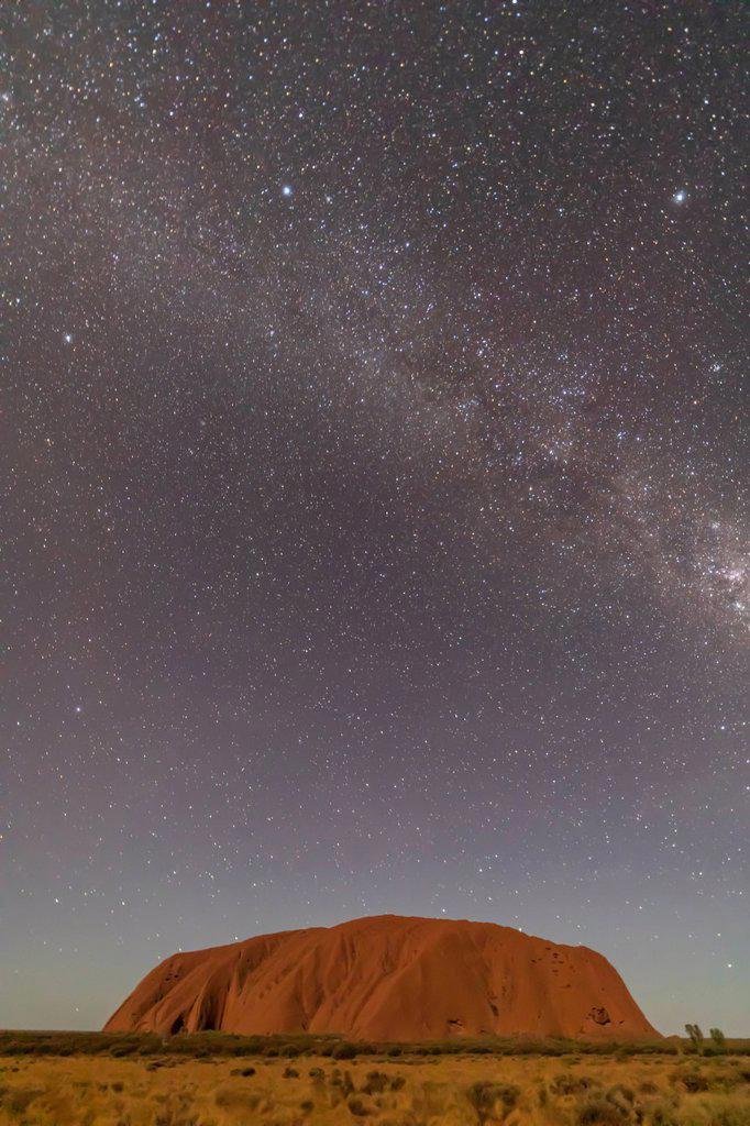 Australia, Northern Territory, Milky Way galaxy over Uluru (Ayers Rock) at dusk