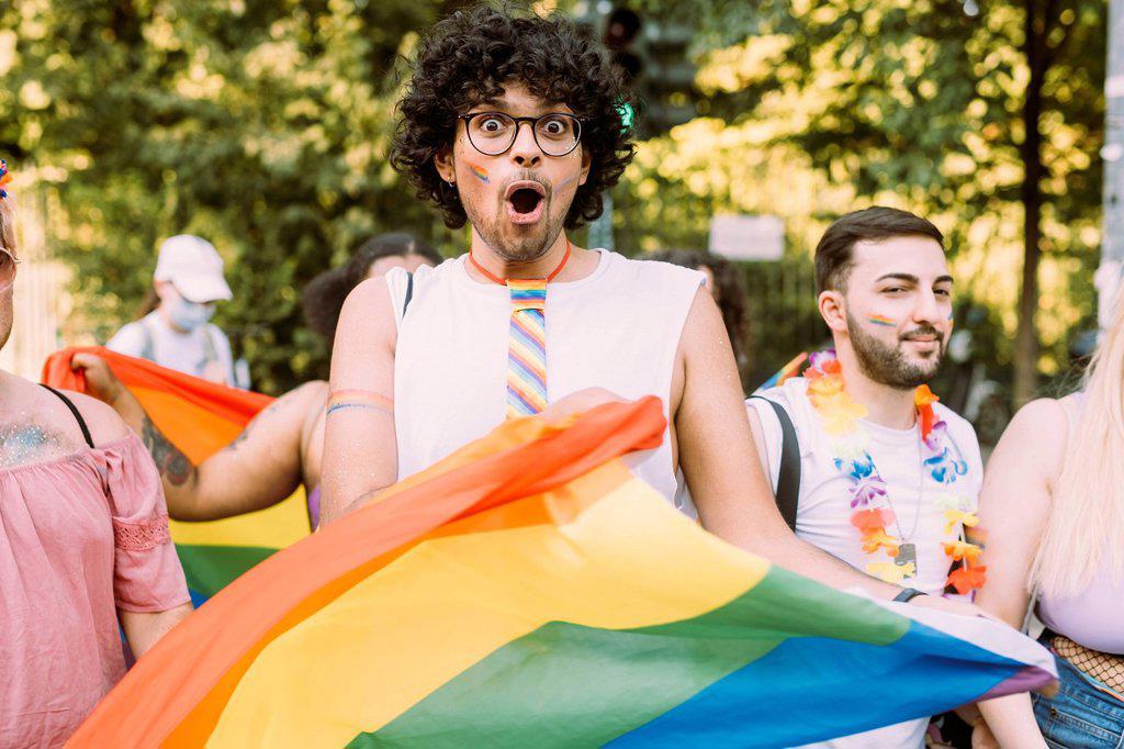 Male and female friends protesting for equal rights in pride event