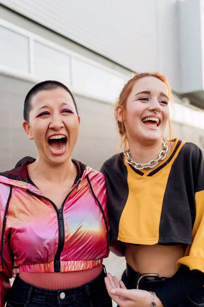 Cheerful multiracial women laughing together