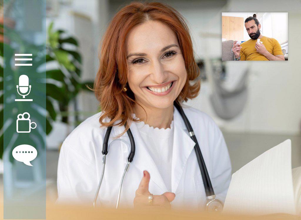 Smiling doctor consulting patient on video call