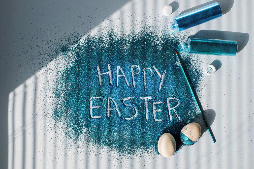 Happy Easter written in¶ÿturquoise colored glitter