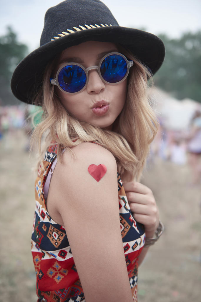 Portrait of hipster woman at the music festival