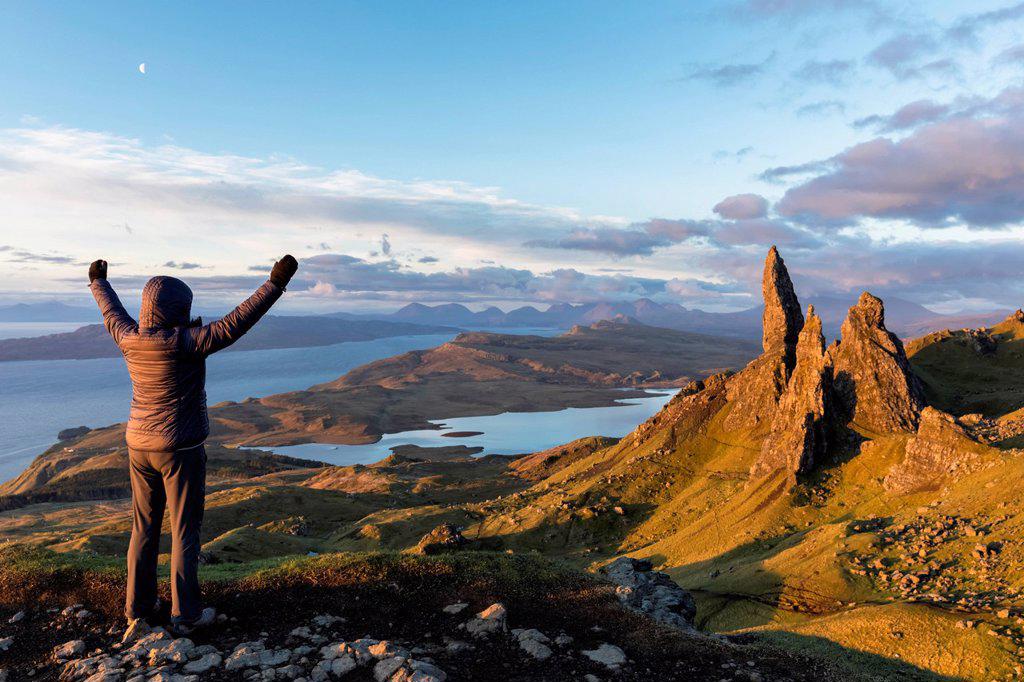 UK, Scotland, Inner Hebrides, Isle of Skye, Trotternish, tourist on peak near The Storr