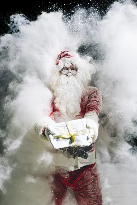 Santa Claus showing gift