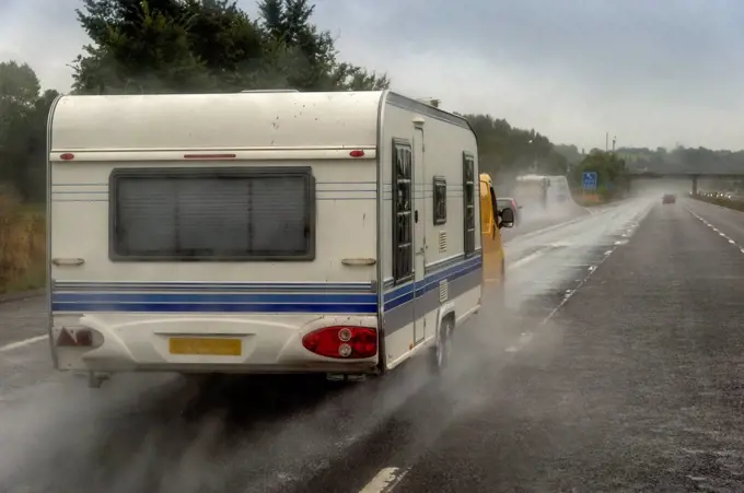 Caravan on motorway in rain