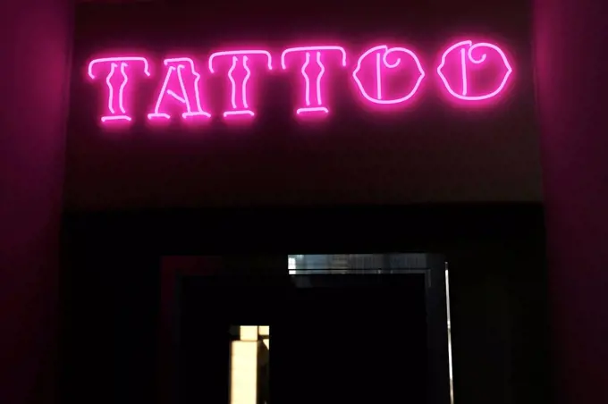 Illuminated tattoo text on door