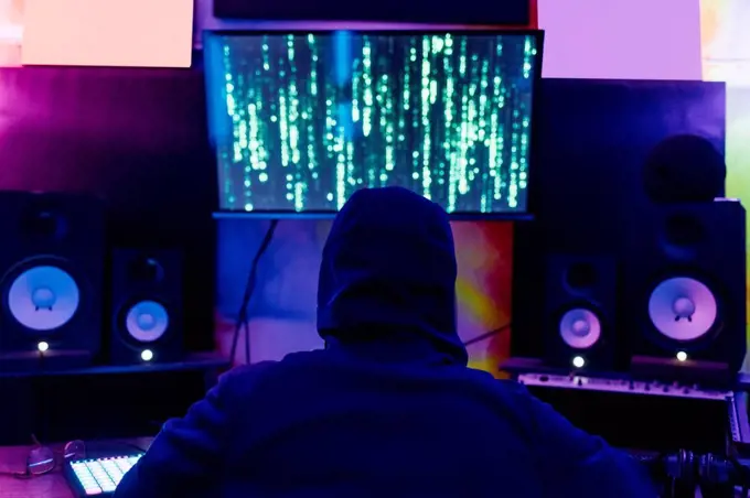 Man hacking computer data at home