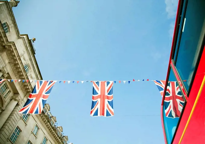 British flags hanging against clear sky