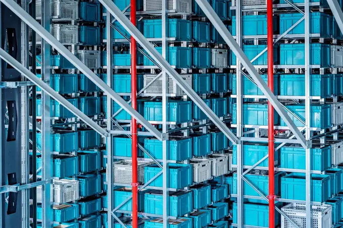 Blue containers in automatized high rack at warehouse