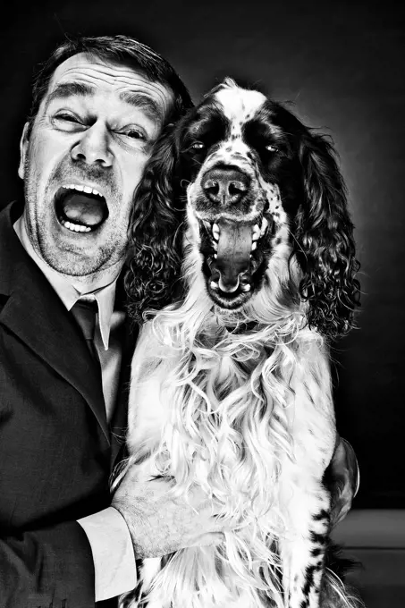 Portrait of mature man and English Springer Spaniel shouting