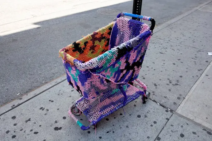 USA, New York, Urban knitting on shopping cart