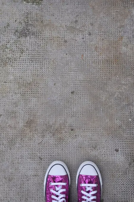 Germany, Bavaria, Pink shoes on concrete floor
