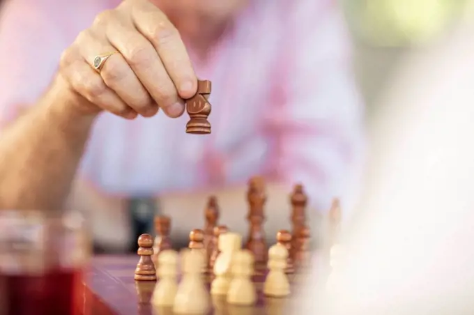 Close-up of senior couple playing chess