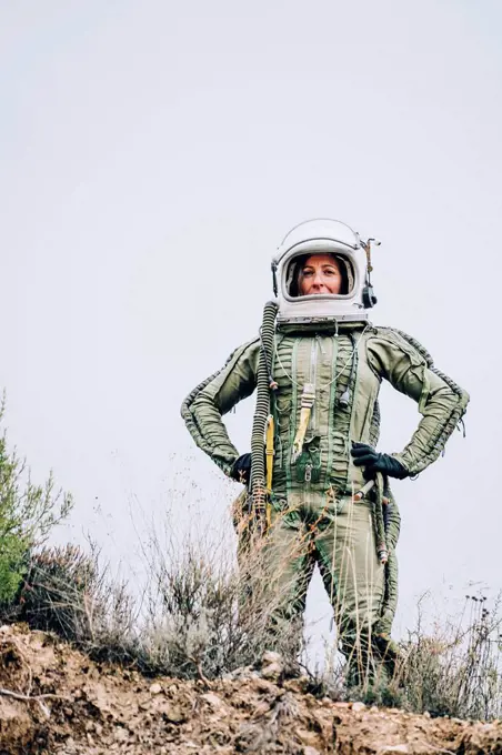 Woman in space suit exploring nature