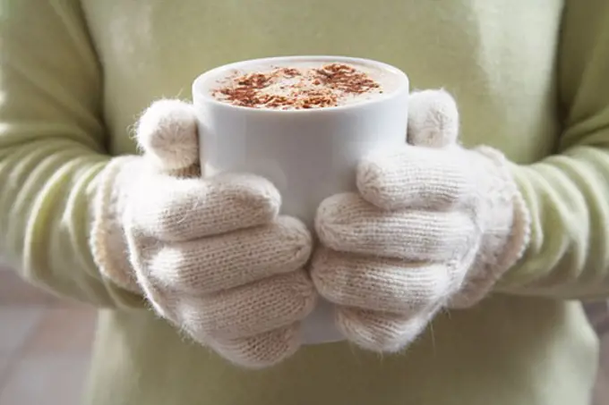 Close-up of Woman Holding Mug of Hot Chocolate   