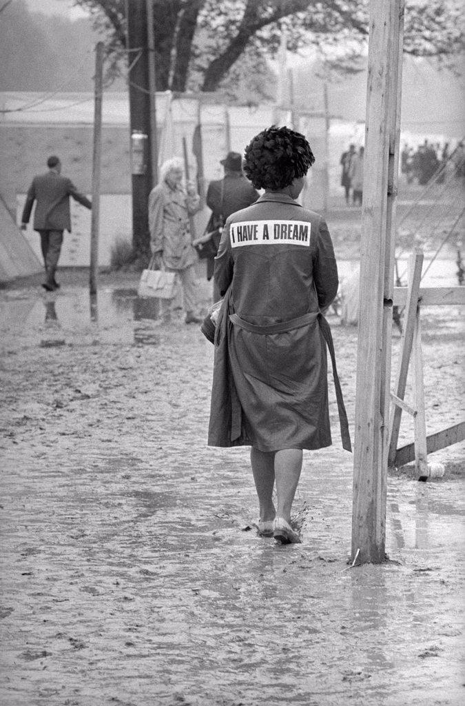 Rear View of African-American Woman wearing a "I Have a Dream" Jacket Walking through Mud in Shantytown known as "Resurrection City", Washington, D.C., USA, photographer Thomas J. O'Halloran, Marion S. Trikosko, May 24, 1968