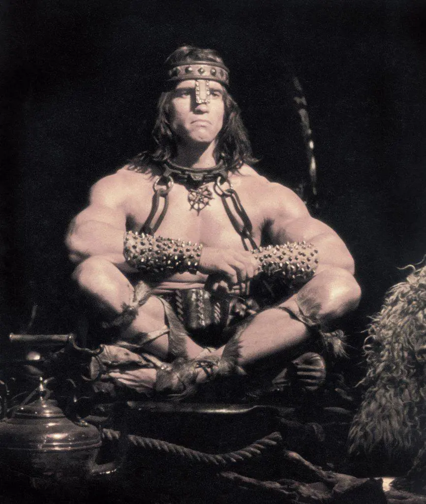 Arnold Schwarzenegger, Full-Length Seated Portrait, on-set of the Film, "Conan the Destroyer", Universal Pictures, 1984