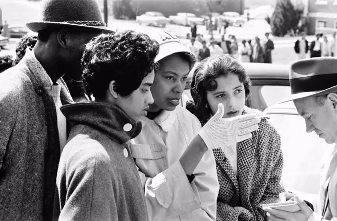 Four African American Students Talking to Reporter during recent Civil Rights Activities involving other Alabama State College Students, Montgomery, Alabama, USA, photograph by Thomas J. O'Halloran, March 1960