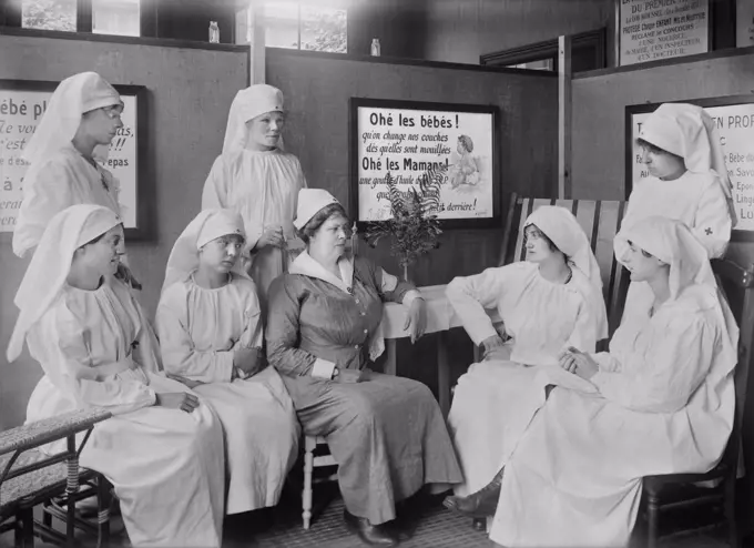 Miss Smythe, Head Nurse, American Red Cross, and staff of Volunteer Workers, attending Child Welfare Exhibit, St. Etienne, France, Lewis Wickes Hine, American National Red Cross Photograph Collection, July 1918