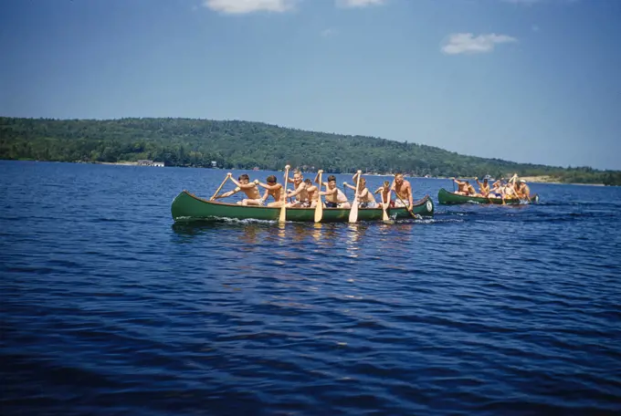 Camp Boys rowing Canoes, Camp Sunapee,  New Hampshire, USA, Toni Frissell Collection, July 1955