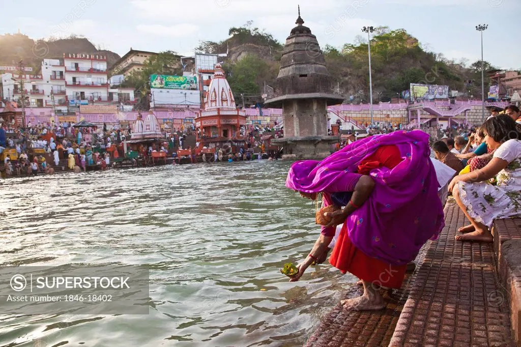 Devotees performing rituals at a ghat, Haridwar, Uttarakhand, India -  SuperStock