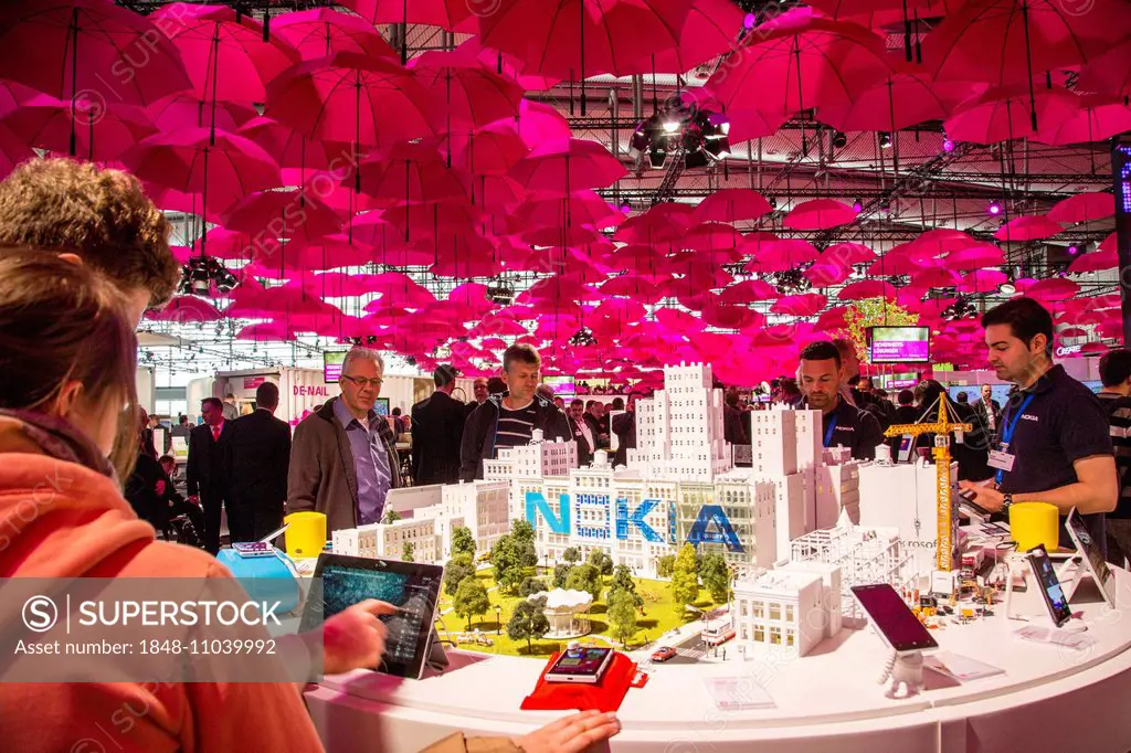 Deutsche Telekom stand, many pink umbrellas forming a roof over the stand, computer fair CeBIT 2014, Hanover, Lower Saxony, Germany