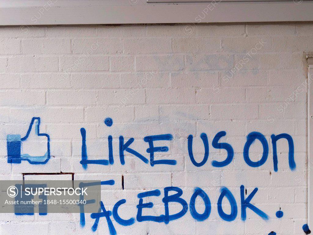Stock Photo: 1848-15500340 Like us on facebook call to action painted on a brick wall, United Kingdom