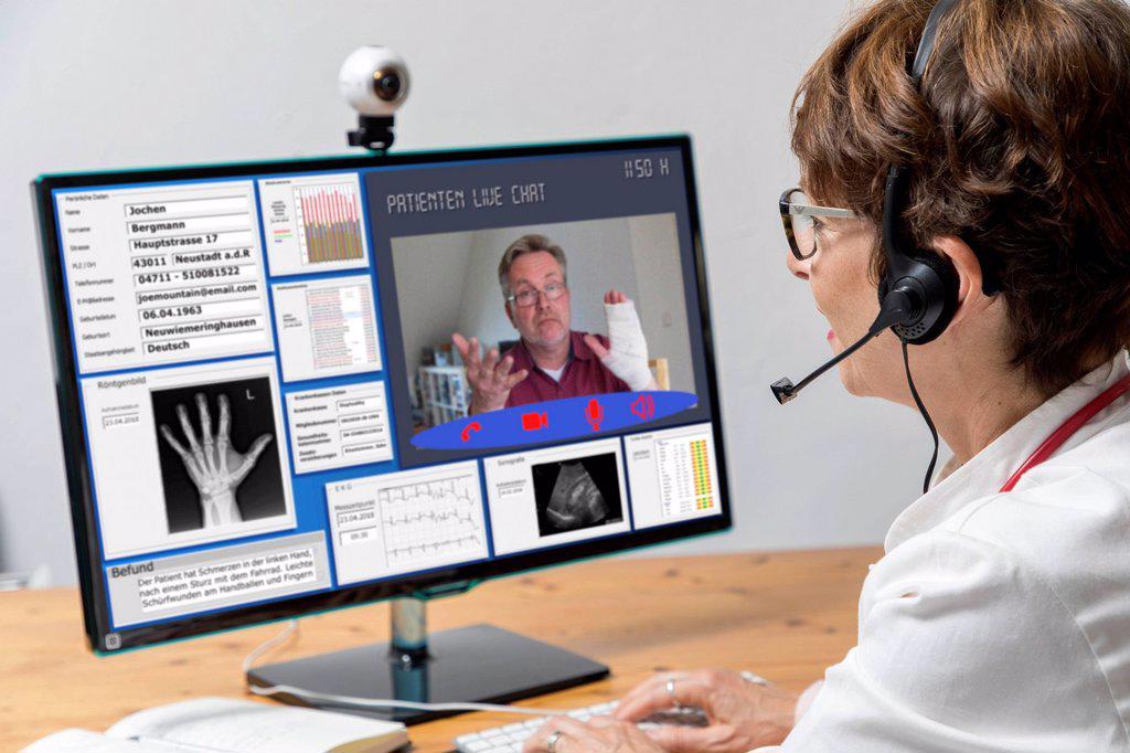 Symbol photo for telemedicine, doctor in a practice, communicates with the patient via a webcam, patient data and findings on the monitor, Germany