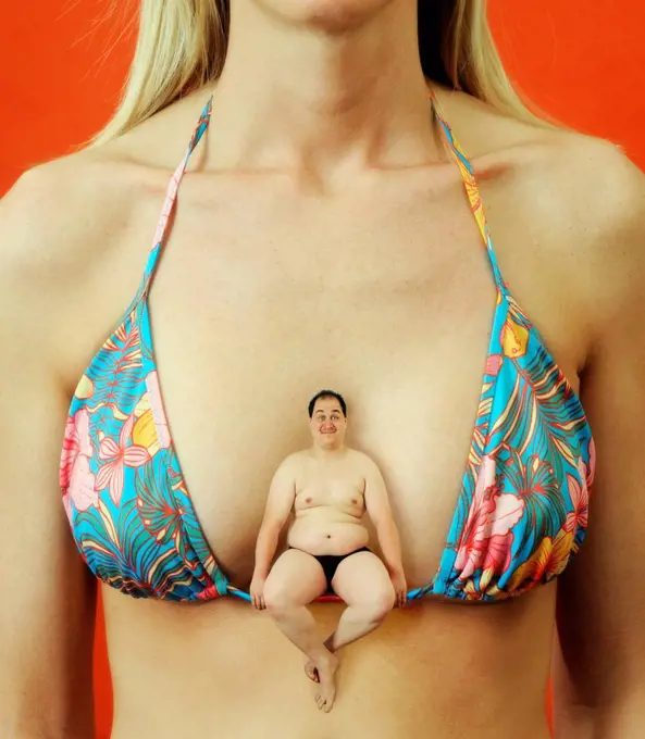Tiny fat man sitting on a woman's bikini top
