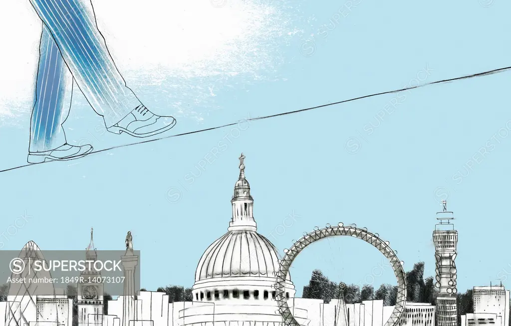 Businessman walking on tightrope above sights of London