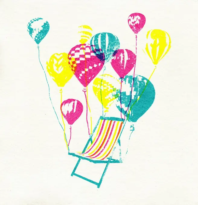Balloons lifting empty deckchair into the air