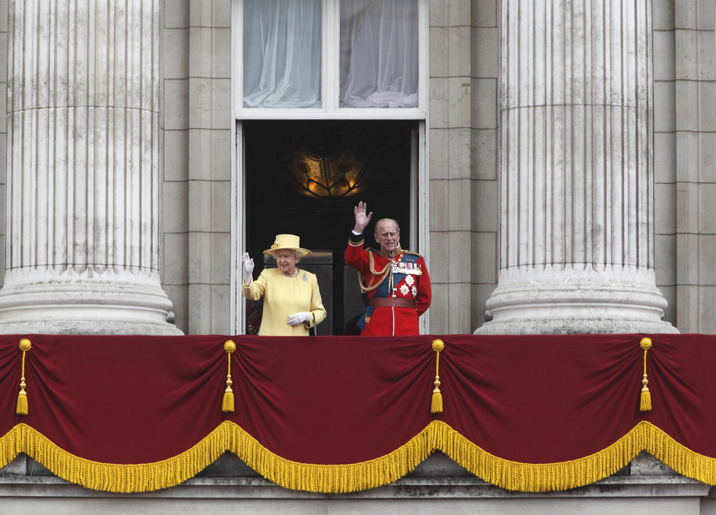 Queen Elizabeth II and Prince Philip wave from the Balcony of Buckingham Palace at the Trooping of the Colour Ceremony June 2012