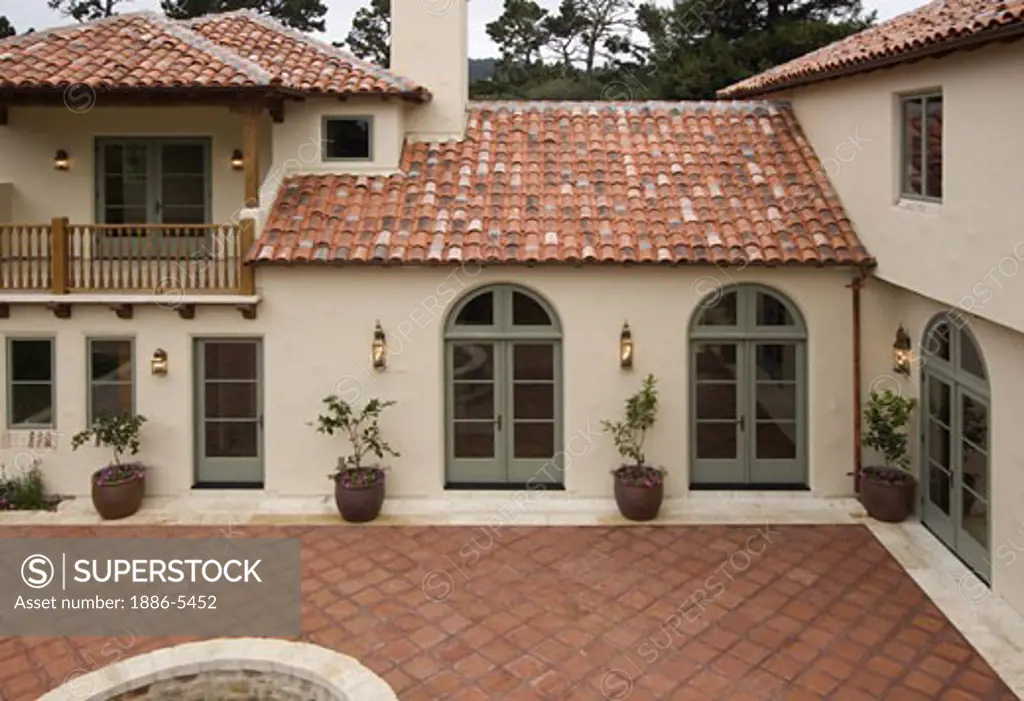 Exterior Of A Spanish Style Luxury Home With Stucco Walls Red Tile Roof And Mexican Patio Superstock - Exterior Paint Colors That Go With Red Tile Roof
